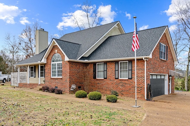 view of front of house with a front yard and a garage