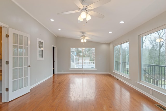 spare room featuring light hardwood / wood-style floors and ceiling fan