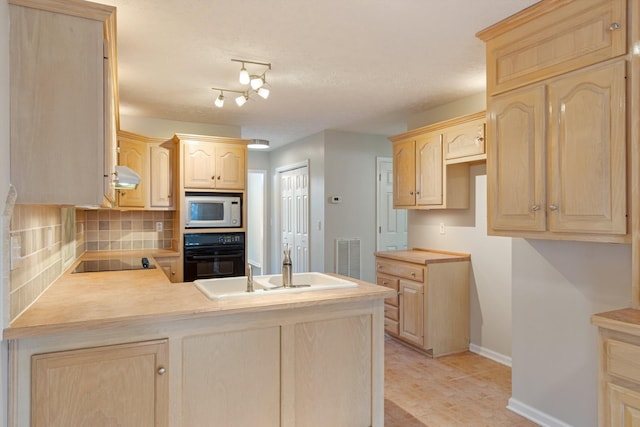 kitchen with black appliances, decorative backsplash, extractor fan, and light brown cabinetry