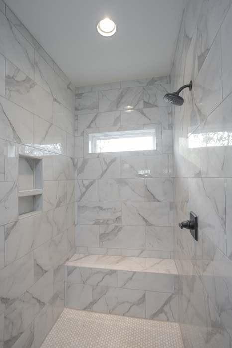 bathroom with a tile shower