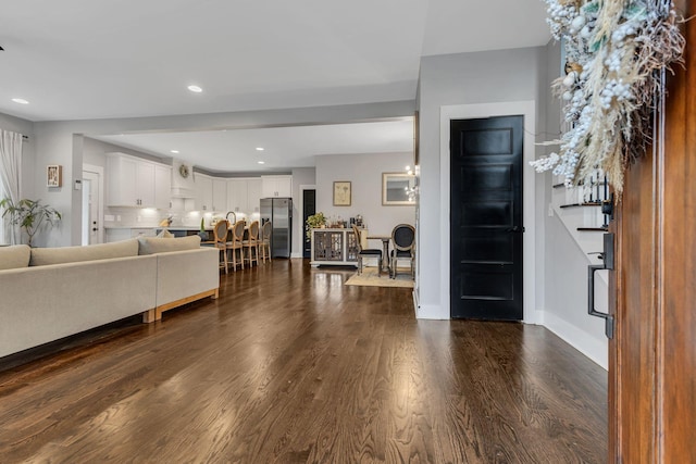 entrance foyer with dark hardwood / wood-style floors