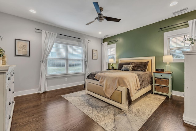 bedroom featuring ceiling fan and dark hardwood / wood-style floors