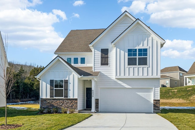 view of front of home with a garage and a front lawn