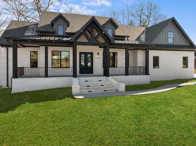 view of front of home featuring a front lawn and a porch