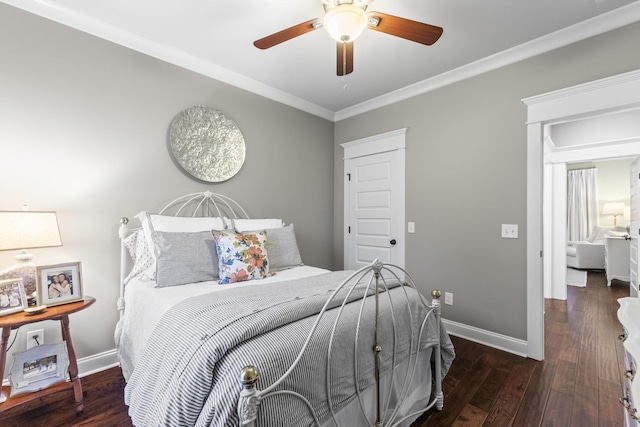 bedroom with dark hardwood / wood-style floors, ceiling fan, and crown molding