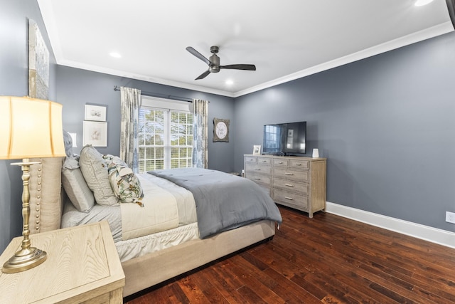 bedroom with dark hardwood / wood-style flooring, ceiling fan, and ornamental molding