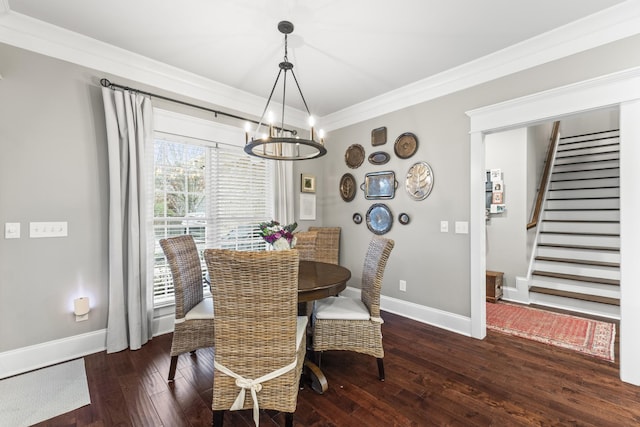 dining room with a chandelier, dark hardwood / wood-style flooring, and crown molding