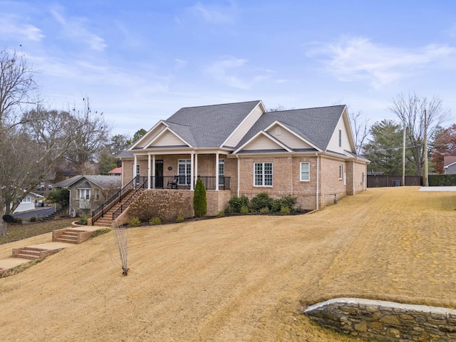 view of front of house featuring a porch and a front yard