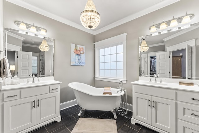 bathroom featuring a bathing tub, vanity, and ornamental molding