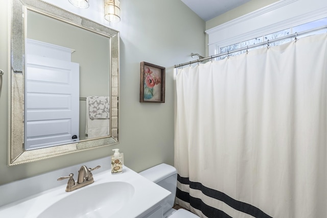 bathroom featuring sink and toilet