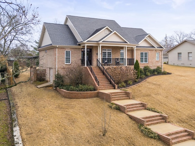 view of front of house featuring a porch and a front yard