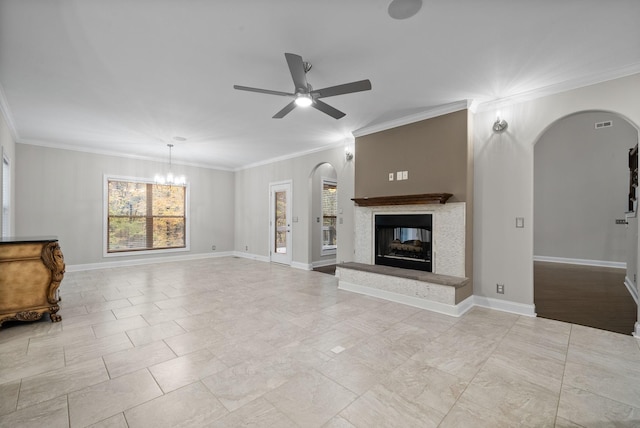 living room featuring ceiling fan with notable chandelier and ornamental molding