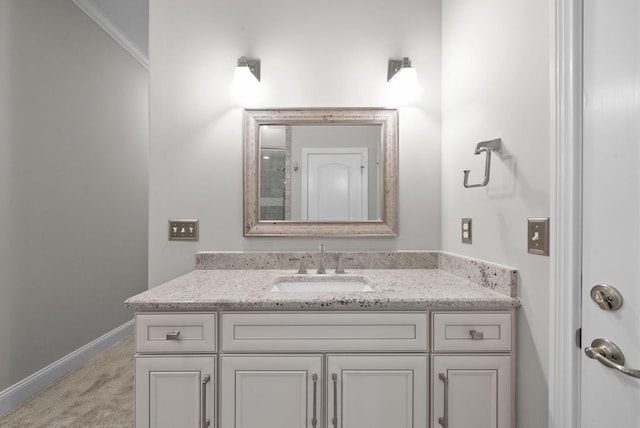 bathroom with vanity and ornamental molding