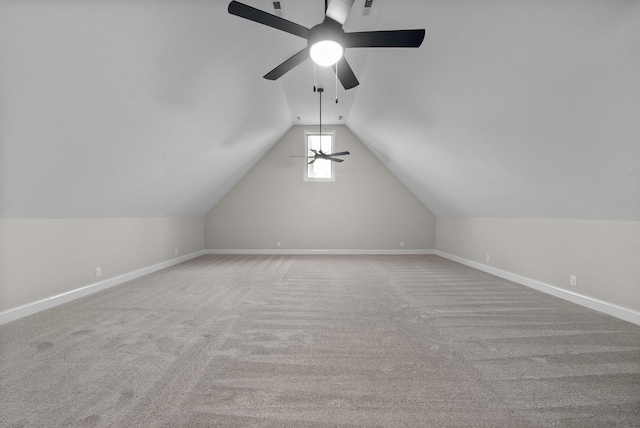 bonus room featuring ceiling fan, light colored carpet, and lofted ceiling