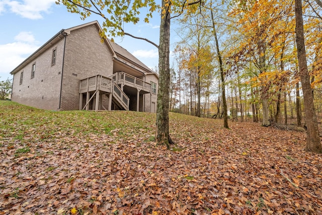 view of side of home featuring a deck