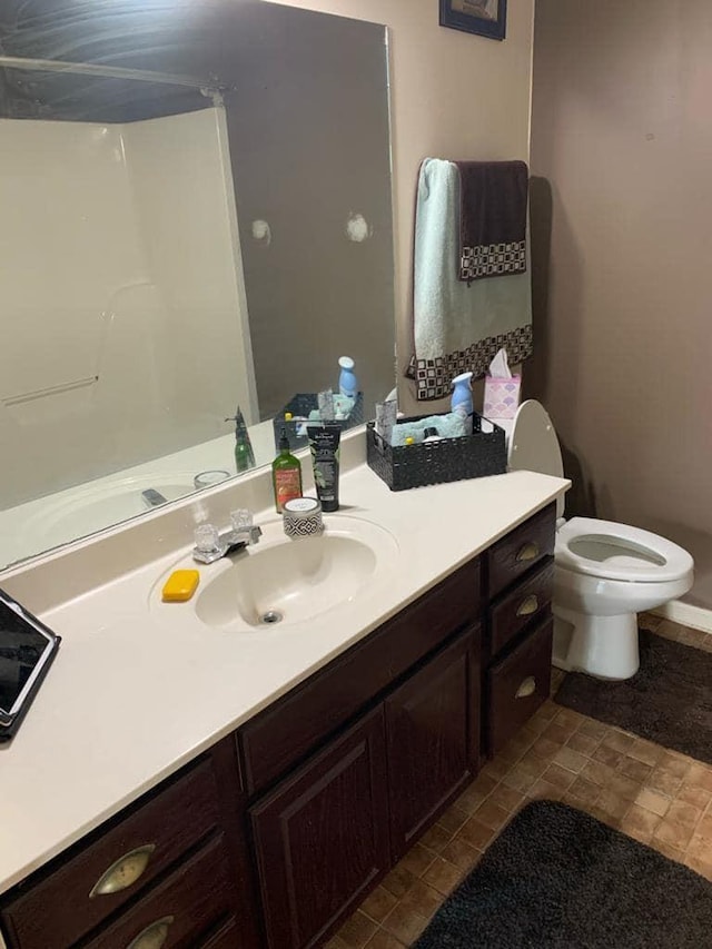 bathroom with vanity and toilet