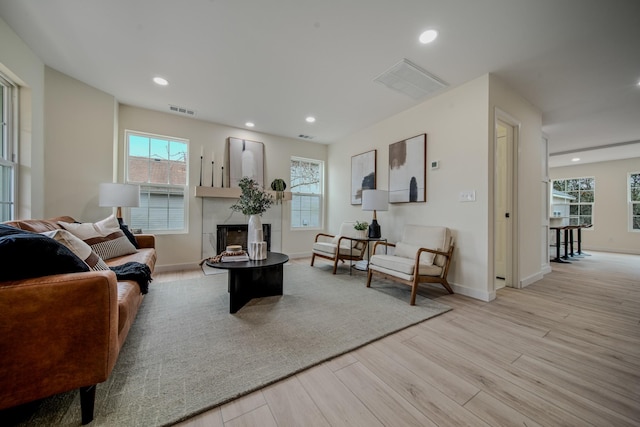 living room with light hardwood / wood-style flooring