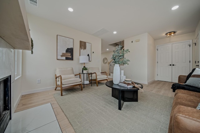 living room with light hardwood / wood-style floors