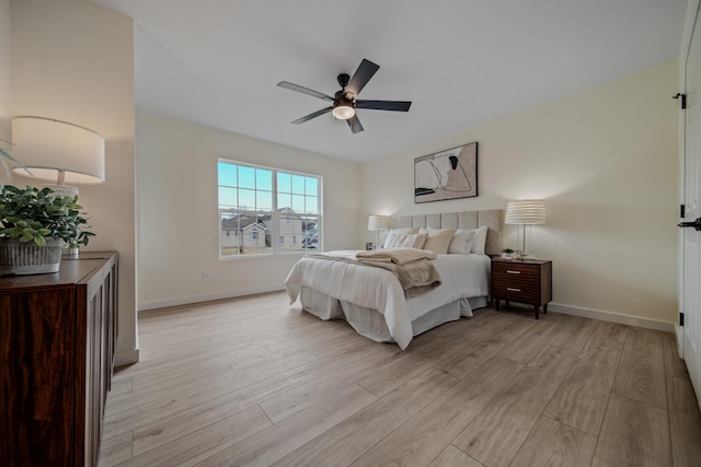 bedroom featuring ceiling fan and light hardwood / wood-style flooring