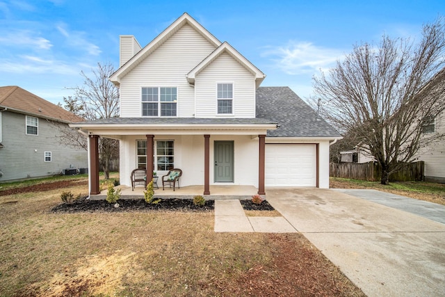 front facade with a front lawn, a porch, and a garage