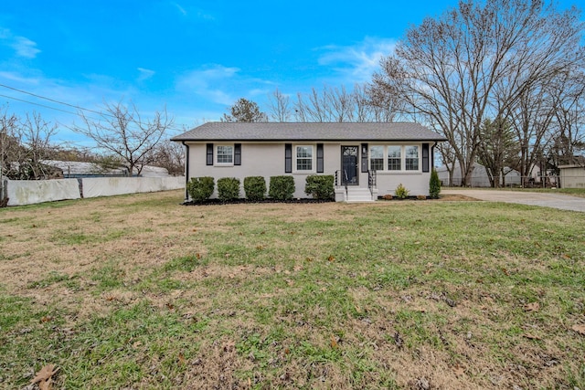 ranch-style house featuring a front lawn