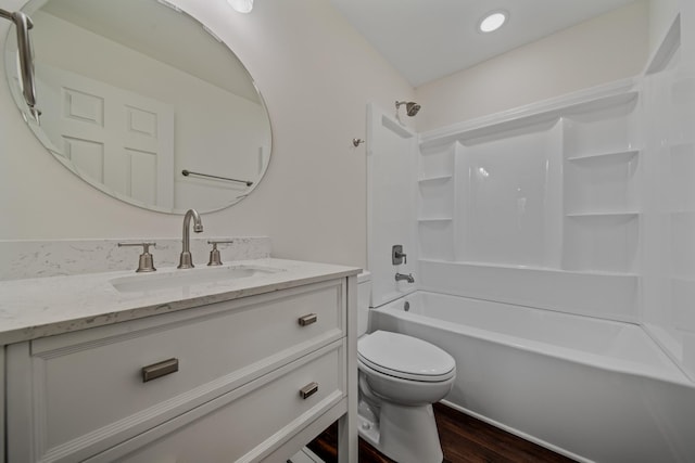 full bathroom with shower / tub combination, toilet, vanity, and hardwood / wood-style flooring