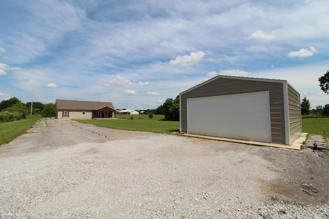 garage featuring a yard