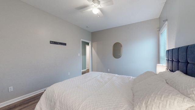 bedroom featuring ceiling fan and dark hardwood / wood-style floors