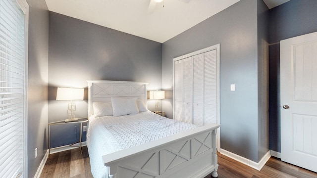 bedroom featuring a closet, dark wood-type flooring, and ceiling fan