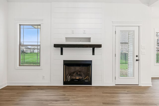 unfurnished living room featuring hardwood / wood-style floors