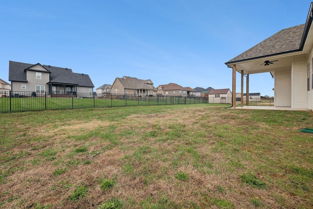 view of yard featuring ceiling fan