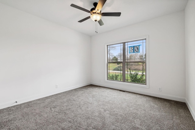 spare room with carpet and ceiling fan