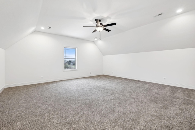 bonus room with carpet floors, vaulted ceiling, and ceiling fan