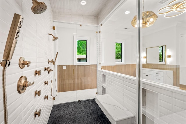 bathroom featuring crown molding and walk in shower