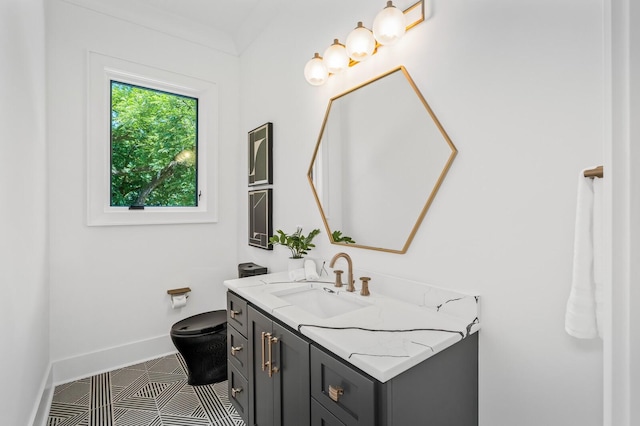 bathroom with tile patterned flooring, vanity, and toilet