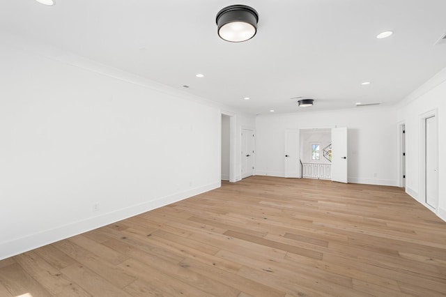 unfurnished room with light hardwood / wood-style floors and ornamental molding