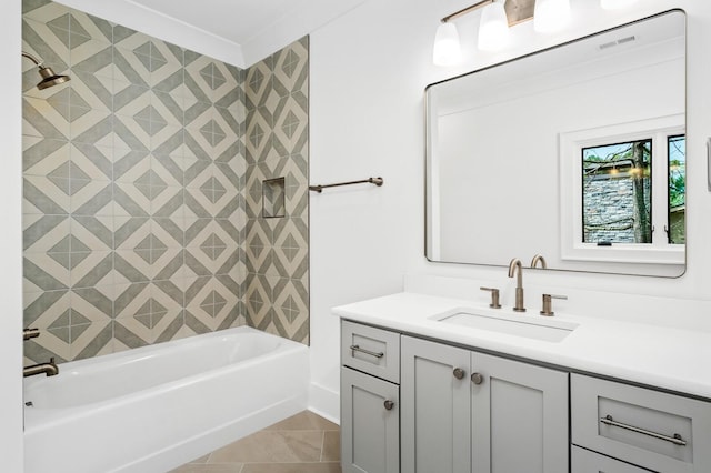 bathroom with tile patterned floors, vanity, shower / tub combination, and crown molding