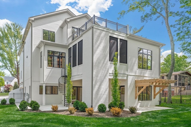 back of property featuring a pergola, a yard, a balcony, and a patio