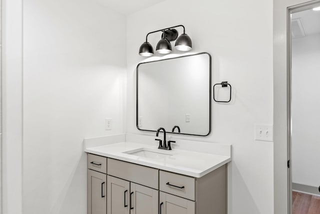 bathroom with vanity and hardwood / wood-style flooring