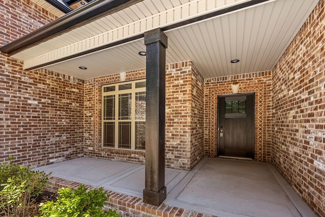 entrance to property featuring a patio area