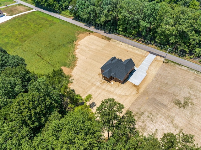 birds eye view of property with a rural view