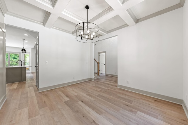 unfurnished dining area featuring beamed ceiling, an inviting chandelier, and light wood-type flooring