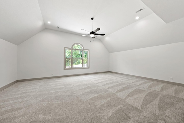 bonus room with ceiling fan, lofted ceiling, and light carpet