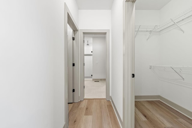 hallway with light wood-type flooring