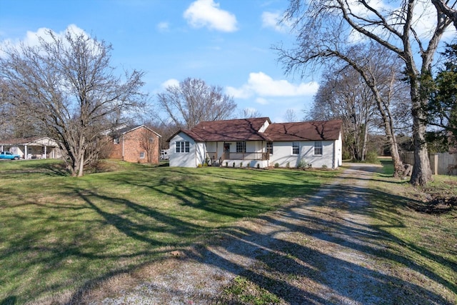 ranch-style home featuring a front lawn