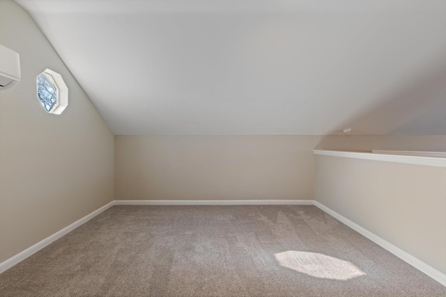 bonus room with lofted ceiling and carpet floors