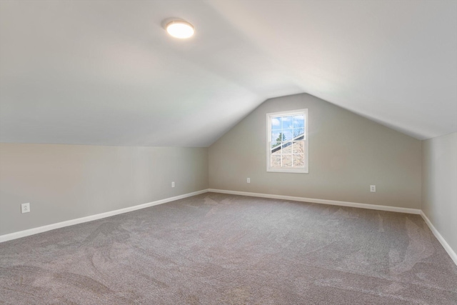 bonus room featuring carpet and lofted ceiling