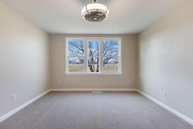 unfurnished room featuring carpet floors