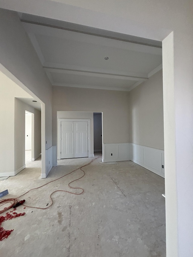 spare room with beamed ceiling