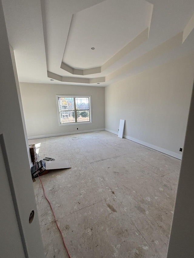 empty room with a tray ceiling